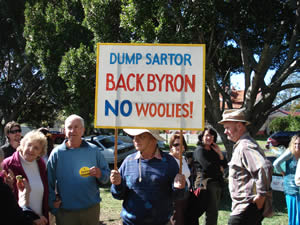 mullumbimby local with dump sartor  no woolies placard